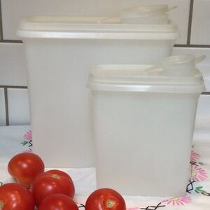 2 Tupperware food storage containers. Large 3 quart and smaller 1 quart size.